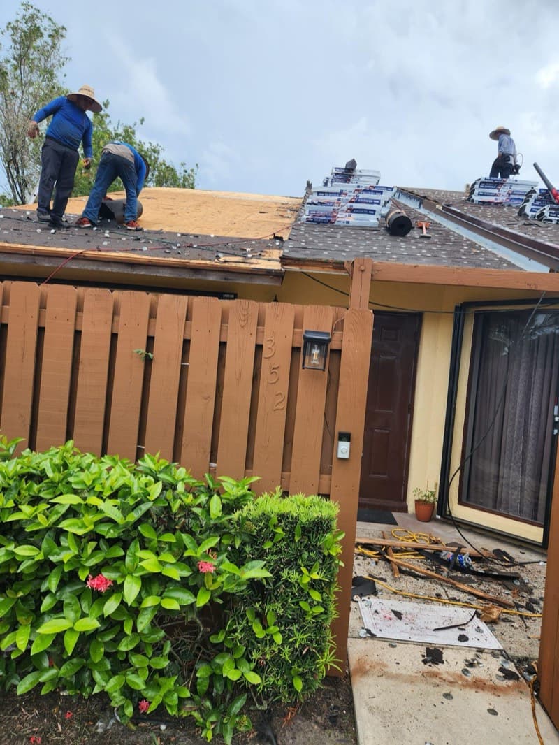 Crew installing shingles