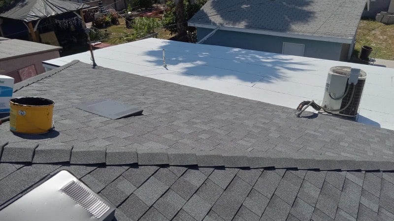 Worker repairing exposed roof decking