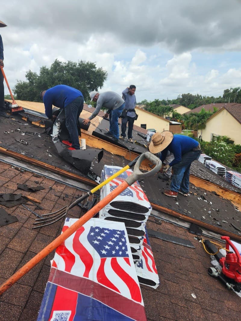 Crew installing new roofing material